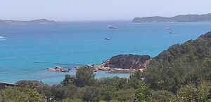 a view of a body of water with boats in it at VILLA CLAUDIO e LUNETTA in Villasimius