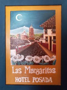 a sign forlas margaritas hotel fossaq at Las Margaritas Hotel Posada in Tapalpa