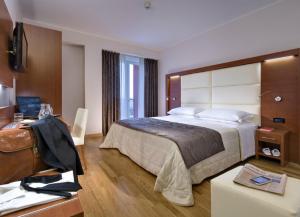 Posteľ alebo postele v izbe v ubytovaní Hotel Lo Zodiaco