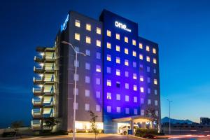 a rendering of the one hotel at night at One Puebla Serdan in Puebla