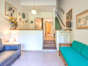 A seating area at Holiday Home in Punta Ala by the Sea