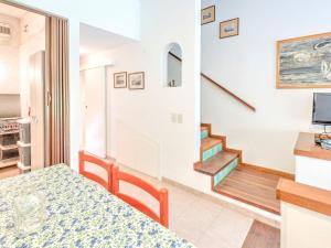 A television and/or entertainment centre at Holiday Home in Punta Ala by the Sea