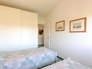 A bed or beds in a room at Holiday Home in Punta Ala by the Sea