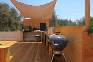 a bbq grill on a wooden deck at Donna Maria in Cava D'aliga