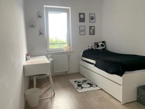 Posteľ alebo postele v izbe v ubytovaní Apartamenty Sunrise Kolobrzeg Podczele