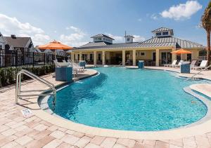 a large swimming pool in front of a house at Casa Na Disney/ Summerville Resort in Orlando