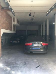 
a car parked in a garage next to a building at Amsterdam Downtown Hotel in Amsterdam
