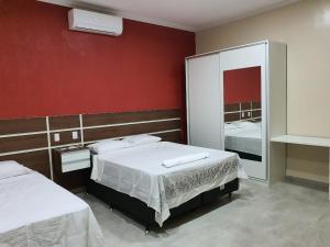 Ένα ή περισσότερα κρεβάτια σε δωμάτιο στο Tororoi Riberalta Apartments +14 φωτογραφίες