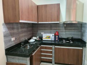 Η κουζίνα ή μικρή κουζίνα στο Tororoi Riberalta Apartments