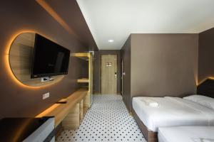 Postel nebo postele na pokoji v ubytování The Feeling Hotel