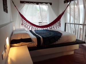 A bed or beds in a room at Casa San Francisco Honda
