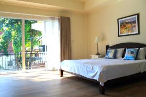 a bedroom with a bed and a large window at Koh Chang 6 Bedroom Villa with Private Pool and Garden in Ko Chang +50 photos
