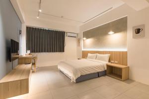 A bed or beds in a room at Shijo Inn
