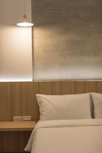 A bed or beds in a room at Shijo Inn