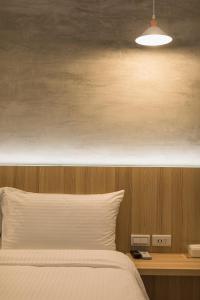 A bed or beds in a room at Shijo Inn