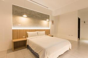 A bed or beds in a room at Shijo Inn