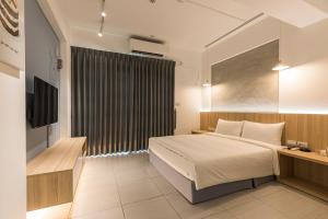 A bed or beds in a room at Shijo Inn