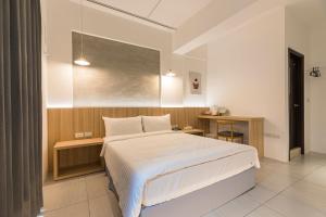 A bed or beds in a room at Shijo Inn