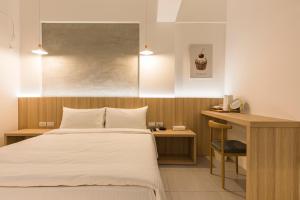 A bed or beds in a room at Shijo Inn
