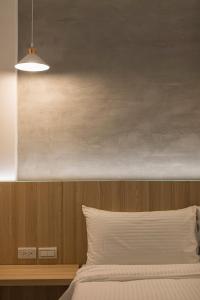 A bed or beds in a room at Shijo Inn