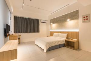 מיטה או מיטות בחדר ב-Shijo Inn