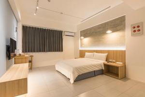 A bed or beds in a room at Shijo Inn