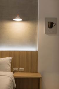 A bed or beds in a room at Shijo Inn