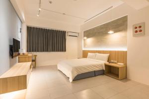 A bed or beds in a room at Shijo Inn