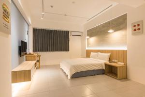 A bed or beds in a room at Shijo Inn