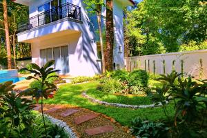 a garden in front of a house at Koh Chang 6 Bedroom Villa with Private Pool and Garden in Ko Chang
