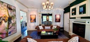 a living room with a couch and a fireplace at White Porch Inn in Provincetown