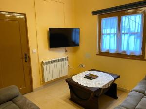 TV a/nebo společenská místnost v ubytování Casa Tali