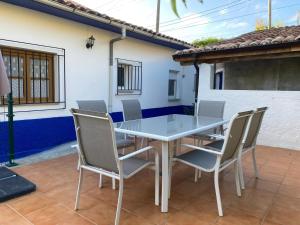 a table and chairs on the patio of a house at Casa Tali in Llanes