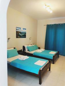 Postel nebo postele na pokoji v ubytování Hotel Mochlos
