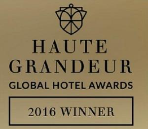 a sign for a honolulu grandeur global hotel awards at Ottoman Hotel Imperial-Special Category in Istanbul