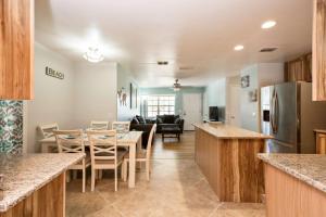 a kitchen and living room with a table and chairs at 1050 Tompkins Drive in Port Orange
