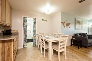 a kitchen and dining room with a table and chairs at 1050 Tompkins Drive in Port Orange
