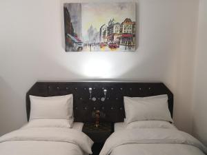 Postel nebo postele na pokoji v ubytování Aryaf Nizwa Hotel Apartments