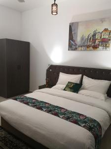 Postel nebo postele na pokoji v ubytování Aryaf Nizwa Hotel Apartments + 13 fotografií