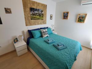 a bedroom with a bed with two towels on it at Apartment Marinela in Krk