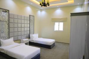 Кровать или кровати в номере Al Chaffa Chalets