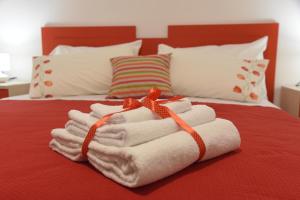 A bed or beds in a room at Il giardino dei tramonti