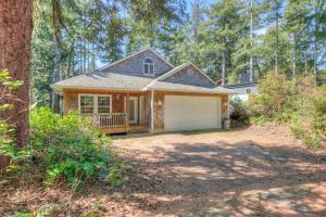 a house with a garage in the woods at 863 Juniper (MCA 499) in Manzanita