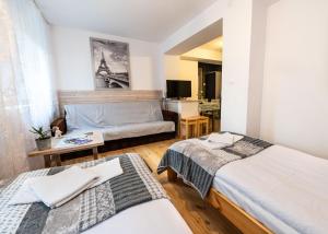 Postel nebo postele na pokoji v ubytování Bagry Rooms