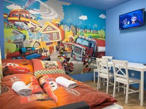 a bedroom with a fire truck and aesame street mural at Mese Panzió Zalakaros in Zalakaros