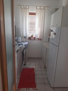 Kuchyň nebo kuchyňský kout v ubytování Apartman Ada