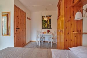 Postel nebo postele na pokoji v ubytování Le Rosier B&B e Appartamento
