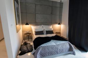 Łóżko lub łóżka w pokoju w obiekcie EL Apartments - Antares