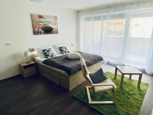 Postel nebo postele na pokoji v ubytování Apartmány Duo Třeboň