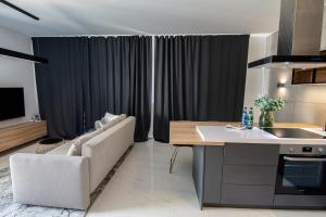 Telewizja i/lub zestaw kina domowego w obiekcie EL Apartments - Antares